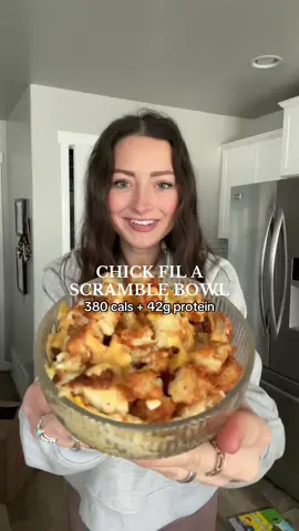 chick fil a scramble bowl⬇️ 380 cals + 42g protein! what ya need: 4 oz @Real Good Foods lightly breaded chicken strips 1 frozen hashbrown (I used one from Trader Joe’s) 1 egg 6T egg whites  2T fat free cheddar cheese  optional: salsa for serving chop hashbrowns into small squares (I microwaved mine for about 30 seconds to make it easier to cut). toss in your air fryer along with your chicken and cook at 330° for 11 minutes. cut chicken into squares when fully cooked. scramble your egg whites and egg — waiting until the very last second to scramble the actual egg yolk. don’t forget to season your eggs! assemble your eggs, chicken and hashbrowns. top with your fat free cheddar cheese (HACK: rinse and dry your fat free cheese and I promise it will actually melt!). pop bowl in the microwave just to melt the cheese. top with salsa if ya want and ENJOY!  tag me @lexingtonbrewer if you make this and be sure to follow for a glimpse into my life as a busy mom of 3 who loves to create yummy meals in my kitchen 💓 #chickfilabreakfast #highproteinrecipes #breakfastbowls #highproteinlowcalorie #busymomsgetfit #busymommeals #naturalweightlossjourney #momof3  #highproteinbreakfast 