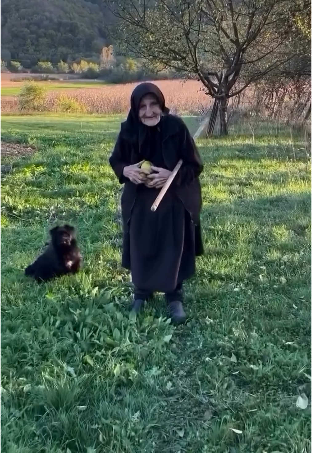 What makes a gift valuable? It’s not the price tag or the brand name—it’s the intent, the history, the love woven into its offering. Somewhere in a village where the roads are narrow and life moves slower, a 90-year-old grandmother stands in her garden, cradling a handful of plump apples and sun-warmed plums. She hands them to you, eyes gleaming with a quiet pride. It’s not just fruit; it’s a piece of her life, the land she’s tended, and the traditions she’s kept alive through decades of summers and winters. Romanian villages are built on the bedrock of stories, shared between generations. For many elders, their gardens are not just sources of food—they’re heirlooms of resilience and memory. A few rows of tomatoes, grapevines bending under the weight of harvest, a gnarled apple tree planted by a grandfather long gone. She’s offering you more than what she picked that morning; it’s the taste of a simpler time, and the warmth of a world that values giving over receiving. So when she presses that fruit into your hands, you feel the weight of something irreplaceable. Something almost sacred. Will you remember her—the crinkles around her eyes, the way her fingers traced the fruit’s surface as she handed it to you? Maybe it’s a simple gift, but what it carries is beyond measure. What do we give, if not parts of ourselves? Video by @anca.creta  [ Village Life, Romanian Hospitality, Garden-to-Table, Simple Living, Generational Wisdom, Romanian Elders, Rural Traditions, Fruit Harvest, Heirloom Gardens, Kindness of Strangers, Old Customs, Romanian Spirit, Heartwarming Encounters, Village Culture, Organic Farming, Rural Romania, Connection to Land, Stories Passed Down, Romanian Generosity, Family Heritage ] #romania #travel #villagelife #romaniatraditions #hospitality #slowtravel #gardentotablecooking  