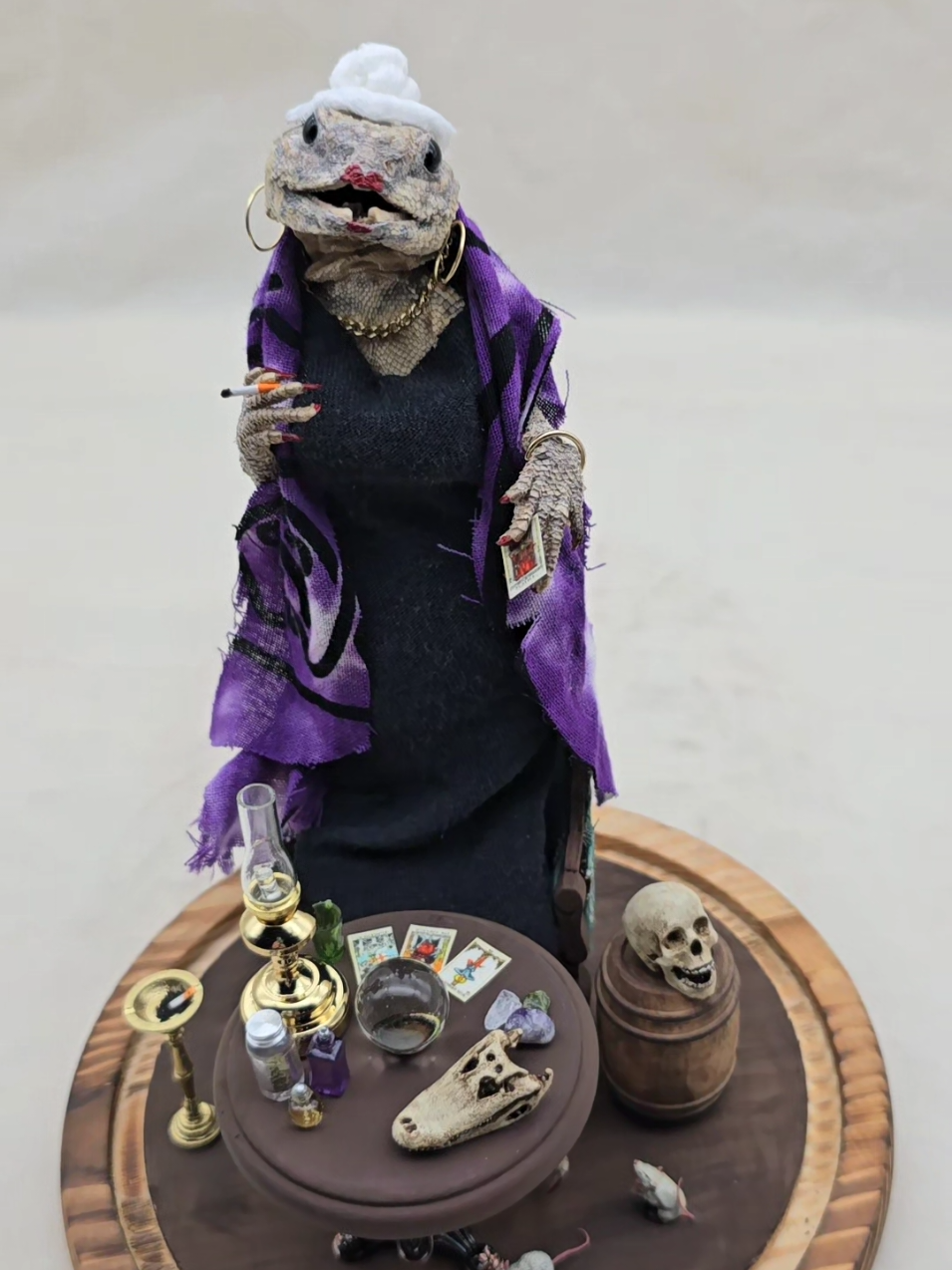 Even the all knowing fortune lizard has bad days 😂😂🦎🔮 #fortuneteller #witch #tarot #hoodoo #voodoo #taxidermy #odd #granny #oldlady #baddie #bosslady #wise #fyp #memes #weird #purple #bun #lipstick #nails #goth #gothicdecor #skulls #bones #miniatures 