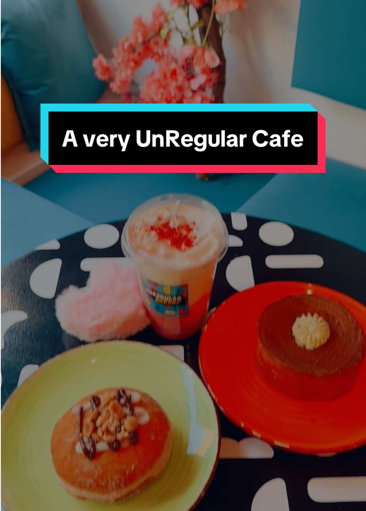 A little stroll to a super cute cafe with unique pastries and drinks 🥐☕️ I got the strawberry rose Lattini which mimics the appearance of a martini and instead of 3 olives they use 3 mini croissants. They were sold out of mini croissants that day but the drink was super refreshing! It gave me a nostalgic kick as it almost tasted like Rooh Afza a popular rose drink in South Asian Countries. Their burra croissant is Round filled with burrata, basil, and basil pearls! It was super filling and yummy!  For some sweet bites, I got their vegan nutella and cream cheese bombolone it was super chocolatey and creamy! I loved the nut toppings as those crunchy bites added some fun crunch and also balanced the sweetness! The space is artsy but also quite spacious, there is seating area in the front, back and at the rear end. Overall it is indeed a pretty UNREGULAR cafe 😜 @Unregular Bakery  #uniquecafenyc#cafesofnyc#lattini#bombolone#unregularbakerynyc#fypシ#viralvideo 