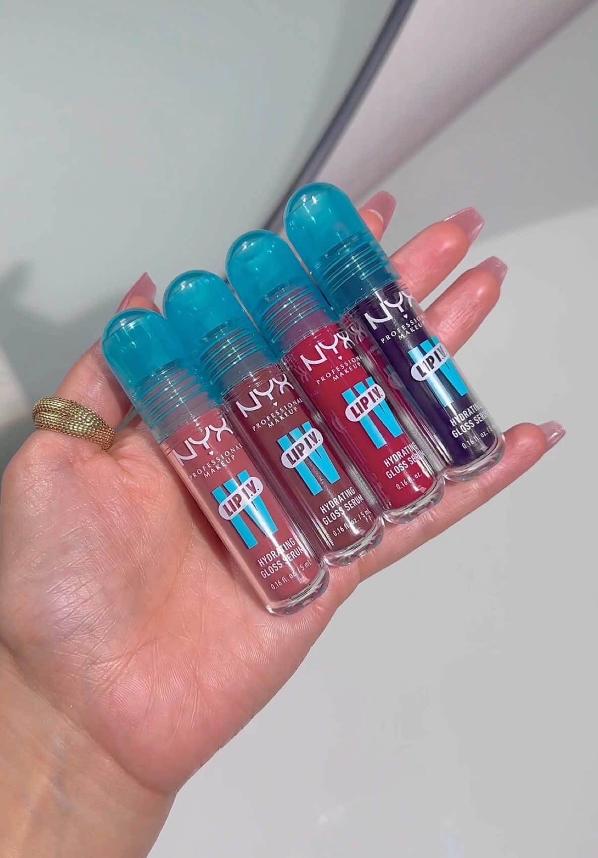 ad Swatching the new Lip IV glosses from @nyxcosmetics_uk 🎀🖤   The formula on these are absolutely gorgeous, they feel smooth and glide on like butter and leave a super pretty stain. Try for your self and You will love them! 🩷   Shades:   02 hydra honey 08 dripping in rose 11 ready set wet 16 grape gushing   available on Tiktok shop   #lipiv #nyxprofessionalmakeup #lipgloss #liptint #lipstain #lipblush