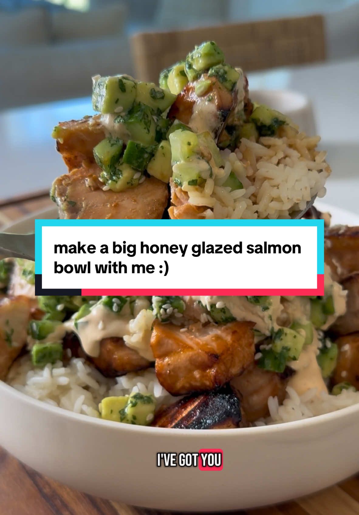 Hi im Nicole and I love sharing my favorite recipes with YOU! This honey glazed salmon bowl with a high protein spicy sauce is mine (and soon to be yours) favorite dinner! Makes 4 servings Salmon bites 1 1/2 pounds salmon, skin removed and cut into bite sized pieces  2 tb avocado oil  2 tb honey 3 tb sriracha  1/4 cup low sodium soy sauce (or coconut aminos/tamari for a gf option) 2 cups cooked rice Cucumber avocado salad 2 persian cucumbers, finely diced 1 avocado, finely diced 1/4 cup cilantro 1 lime, juiced  1 tb honey Spicy sauce 1 cup cottage cheese 1 lime, juiced  1/4 cup sriracha 2 tsp cumin 1 tsp smoked paprika  1 tb honey  Preheat oven to 400F. Coat the salmon in the avocado oil, honey, sriracha and soy sauce. Transfer to a parchment-lined baking sheet. Bake 10-11 minutes, then broil for 1-2 minutes at the end to get that crunchy top. Remove from oven and set aside. Cook rice according to package instructions and set aside. Make the spicy sauce by adding everything to a blender and blending until completely smooth. Taste and adjust seasonings as needed. Last, make the cucumber-avocado salad. Add all ingredients to a bowl and toss well. Finally, assemble your bowls. Add rice first, followed by the salmon bites, then the cucumber-avocado salad, and last, a drizzle of the delicious spicy sauce on top. Enjoy! #salmonbowls #salmon #dinnertonight #dinnerrecipes