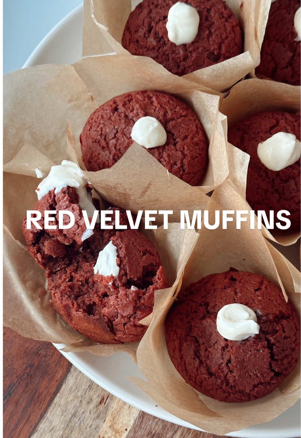 Happy V-Day 🧁✨ a classic dessert to treat yourself & loved ones! wearing the cutest @Hedley & Bennett x Love Shack apron in Palm Beach Rose 💐 recipe below!  Red Velvet Muffins  - 2 eggs (room temp)  - 1 cup monk fruit sugar  - 1/4 cup vegetable oil  - 1/4 cup melted & cooled unsalted butter  - 1 cup buttermilk (I made my own mixing 1 cup 2% milk with 1 tbsp vinegar & letting rest for 15min to curdle)  - 1 tsp vanilla extract  - 1 tbsp vinegar - pinch of salt  - red food colouring (use as much as needed)  - 2 cups all purpose flour  - 1/3 cup cocoa powder  - 2 tsp baking powder  - 1/4 tsp baking soda  Cream cheese filling  - 1/2 cup of cream cheese  - 1/4 cup icing sugar  - splash of almond milk  Preheat oven to 380F. In a big bowl, mix 2 cracked eggs, sugar, veg oil & butter. Make sure your butter is melted & cooled (5-10min) so it doesn’t cook your eggs! Add buttermilk, vanilla extract, vinegar, salt & red food colouring, mix to combine. Add flour over a sifter then cocoa powder, baking soda, baking powder & mix. You can decide whether to add more red colouring if the batter is not a bright red. Cover the batter & refrigerate for 15min while preparing the muffin liners or line your muffin tins with some butter. Bake at 380F for 15-20min & use the toothpick method to check if they’re ready (poke a toothpick in the middle of the muffin & it needs to come out dry).  While the muffins are baking, mix all your cream cheese filling in a bowl & whisk until there’s no clumps. Once the muffins have cooled, poke a hole in the middle using the end of a spoon (or I used a chop stick). Squeeze the filling in the hole using a piping bag (or ziplock bag with a tip cut off like me)  & voila! Red velvet & cream cheese muffins! Enjoy with your loved ones ❤️ #fyp #muffins #redvelvet #ValentinesDay #valentinesdayrecipes #vday #redvelvetcreamcheese #creamcheeswfrosting #healthyredvelvetmuffins #easyandsimpledesserts #healthydessert #monkfruitsugar