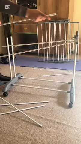 Assembling clothes drying rack.              #assemblingclothesdryingrack #clothesdryingrack #3tierclothesairer #spacesavingdryingrack #foldablerack #IndoorClothesDryer #compactdryingrack #tiktokshop #tiktokmademebuyit #laundaryrackstand 