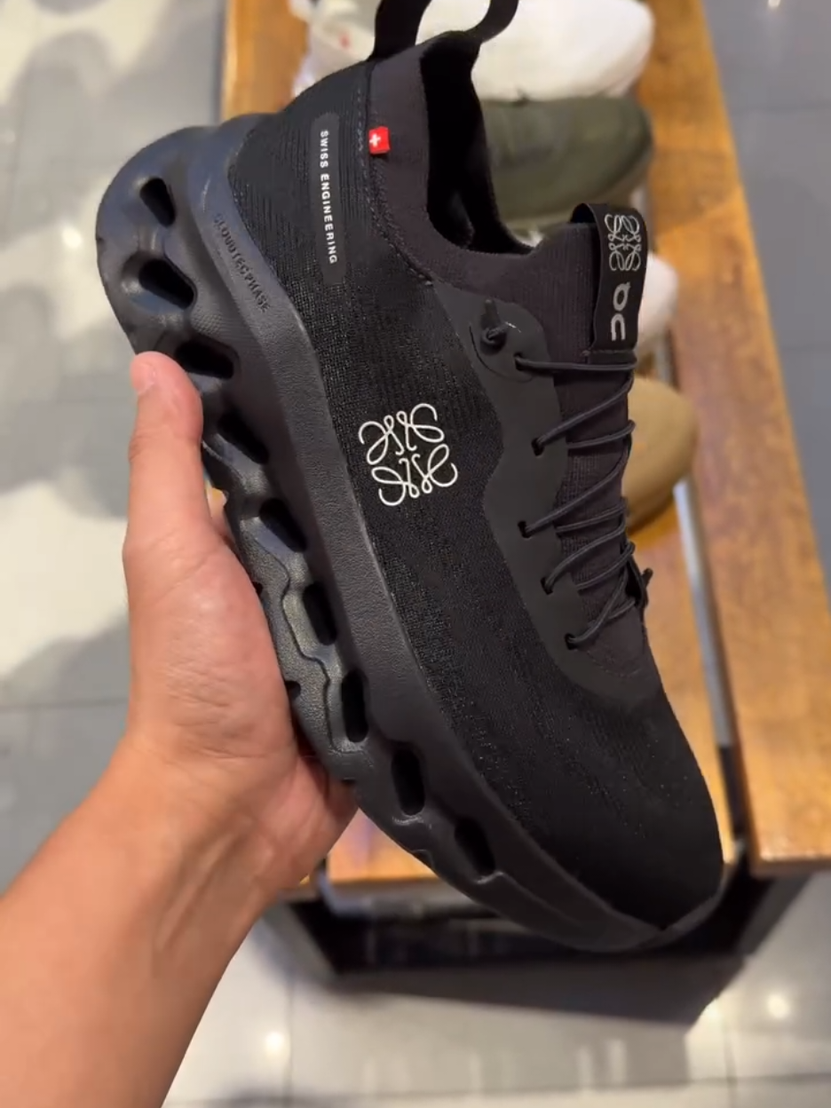 Cloudtilt x LOEWE in sleek All Black—available on hand and ready to elevate your look! Shop now on our website.  #LOEWE #cloudtilt 