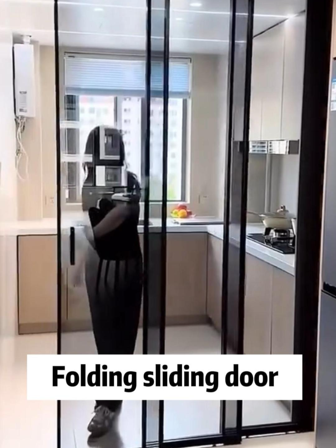 If the kitchen space is small and you want to separate it from the dining area, you can use a tri-fold sliding door. #aluminumdoors #slidingdoors #slidingdoor #kitchendesign #doors #glassdoor #foldingdoor