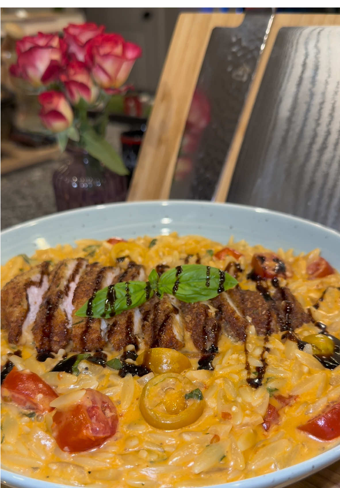 Creamy Tomato Basil Orzo🌿🍅 #Recipe #EasyRecipe #orzo #pasta #DinnerIdeas  In a pan on medium heat add: -2 tablespoons of olive oil  -1 small diced onion  -3 tablespoons of tomato paste  Cook until the onions are soft, then add: -2 tablespoons of minced garlic  -chili pepper flakes (if you want spice)  -1/2 cup of dry white wine  Let this cook for about 2 minutes then add: -4 cups of chicken broth  -1.5 cups of heavy whipping cream  -chicken bouillon to taste Once it comes to a simmer, stir in 1 pound of dry Orzo, and turn the heat down to medium-low.  Stir frequently while it’s cooking, and cook this for about 10 to 12 minutes or until it’s perfectly al dente.  Then turn the heat off, and add: -3 tablespoons of butter  -1 cup of grated Parmesan  -salt & pepper to taste  -2 cups of sliced grape or cherry tomatoes  -1/2 cup of fresh chopped basil  You can serve this with a variety of proteins. Today I made my Crispy Parmesan Chicken Cutlets, but you can also serve this with Salmon, Steak, Shrimp, Scallops, or Grilled Chicken. I like to top the protein off with Balsamic Glaze!  Enjoy💜