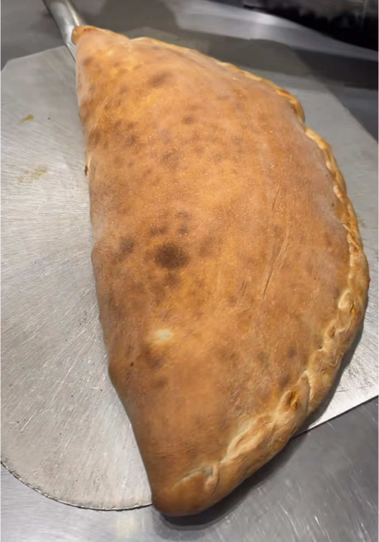 Which calzone cut do you prefer - 1 or 2? 😋😇 #pizza #Foodie #pizzalovers #pizzalove #gourmetpizza #torontofood #torontoeats #torontopizza #foodtoronto #crunchy #asmrsounds #pizzalover #asmr #torontoeats  #food #foodoftiktok #pizzatiktok 