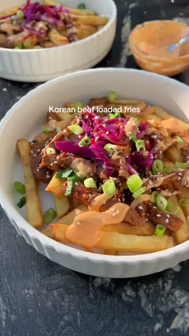 Korean Beef Loaded Fries 😮‍💨 These were absolutely banging and such an easy recipe to throw together! 😍 Thin slices of steak are marinated in a Korean-style sauce, placed on top of crispy fries with a gochujang mayo. Less than 500 calories per portion! ✅ ‼️ MY RECIPE APP is now LIVE - join my recipe club for £4.99 a month (cancel anytime), for exclusive recipes, customisable meal plans, shopping lists, and more through my bio 💕 Ingredients (serves 2):  250g frozen crispy fries  200g steak (I used Rump)  Tsp chopped garlic  Tsp chopped ginger Tbsp light soy sauce  Tbsp dark soy sauce  Tbsp hoisin sauce  Tsp gochujang paste Tsp sesame oil 2 tbsp pickled pink slaw (I use a ready made one from Tesco) Tsp sesame seeds  2 spring onion chopped Gochujang mayo: 40g lighter mayo  ½ tsp gochujang paste  Tsp lime juice 💕Cook the fries according to packet instructions.  💕Next, slice the steak into thin strips before transferring to a bowl.  💕In a separate bowl, add the chopped garlic, ginger, both soy sauce, hoisin sauce along with the gochujang paste and sesame oil. Mix well to combine before pouring ¾ into the bowl with the steak. Leave to one side. 💕Next, add the mayo, gochujang paste and lime juice to a separate bowl mixing to combine.  💕When there is 5 minutes remaining on the fries, add the steak to a hot pan. Fry for a few minutes until cooked through. Add the remaining sauce from earlier, toss to combine and remove from heat. 💕Serve the beef over the cooked fries.  💕Drizzle over the gochujang mayo, before topping with the pickled slaw. Garnish with the sesame seeds and the spring onion.  Calories per portion: 488 l Protein: 26.25g l Fat: 19.25g l Carbs: 50.45g  • • _________ #loadedfries  #dinnerrecipe #EasyRecipes #lowcaloriemeals #highprotein #weightlossfood 