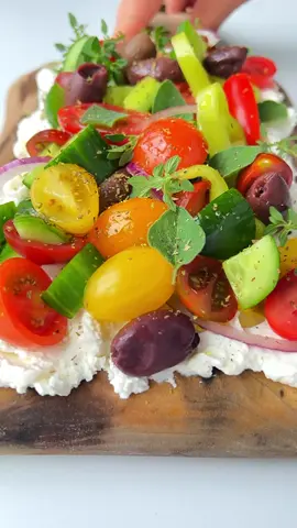 ✨Greek Salad Feta Board 🍅✨ This Greek salad feta board is inspired by both my childhood in Greece and Bulgaria and the trending viral butter board. This recipe is the ultimate showstopper: it’s stunning with an array of brightly colored produce, delicious and fun to eat, and so unique.  INGREDIENTS feta cheese, or any creamy cheese you enjoy yogurt, plain cucumbers, I used mini and chopped them tomatoes, cherry tomatoes  green pepper, (I used a sweet cubanelle pepper) red onion  olives salt, to taste  olive oil oregano baguette https://themodernnonna.com/greek-salad-feta-board/ #greeksalad #feta #appetizers #recipes 