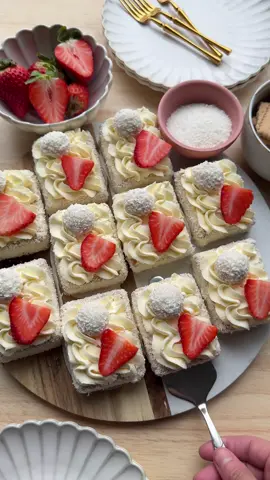 STRAWBERRY SHORT CAKE (NO BAKE) #food #Recipe #dessert #strawberry #shortcake #nobake #easy #fy #fyp #foryoupage CREAM 250 g mascarpone 8 g whipped cream stabilizer (1 tbsp) 30 g powdered sugar 8 g vanilla sugar (1 tbsp) 100 g white chocolate 250 ml heavy cream COATING tea biscuits, 20 cookies FILLING 100 g strawberries GARNISH grated coconut coconut truffles strawberries Melt the white chocolate using a double boiler and let it cool. Place the mascarpone, cream stabilizer, powdered sugar, and vanilla sugar in a bowl. Mix for 1 minute. Add the white chocolate and mix well. Gradually add the heavy cream and whip until firm. Transfer the cream to a piping bag. Cut the strawberries into small pieces. Take a tea biscuit and pipe a dollop of cream on top. Spread some strawberry pieces over it and pipe another layer of cream. Place a second tea biscuit on top. Use a butter knife to evenly spread the cream around the sides. Roll the sides in grated coconut until well covered. Place the dessert on a piece of parchment paper. Pipe a small swirl of cream on top and garnish with a coconut truffle and a strawberry slice. Cover and let it set in the refrigerator for 4-5 hours, preferably overnight, to allow the flavors to develop.