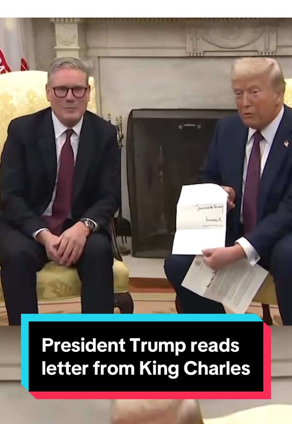 British Prime Minister Keir Starmer presents President Trump with a letter from King Charles during a meeting at the White House on Thursday. The letter includes an invitation for a state visit with the king, which Trump says he accepts. 