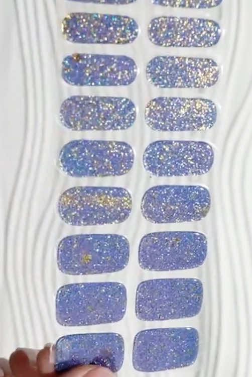 Trending gel nails. Harden after UV light curing. Easy to apply at home. #harunouta #harunoutasemicuredgelnailstrips #semicuredgelnailsticker #newnails #savetime #fastnails #diynails #salonnails #easytouse #gelpolishnails #manicure #nails #uvlight #purplenails #glitternails 