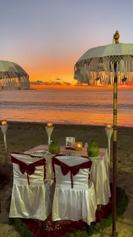 Romantic dinner setup by Jimbaran beach 🌅 The orange-hued sky, the waves, and the scent of flowers scattered on the sand enhance the mood 😍 Special arrangement for Leshween & Sri - “Happy birthday, pretty!” 💐 @Sri @😎GtownJulyKing😎 #bali #birthdaypackage #sunset #balisunset #sunsetdinner #beachdinner #seafooddinner #romanticdinner #cuticutimalaysia #balipackage #pakejbalimurah #pakejbali #jimbaranbali #birthdaycelebration #fyp #rimbunantravels 