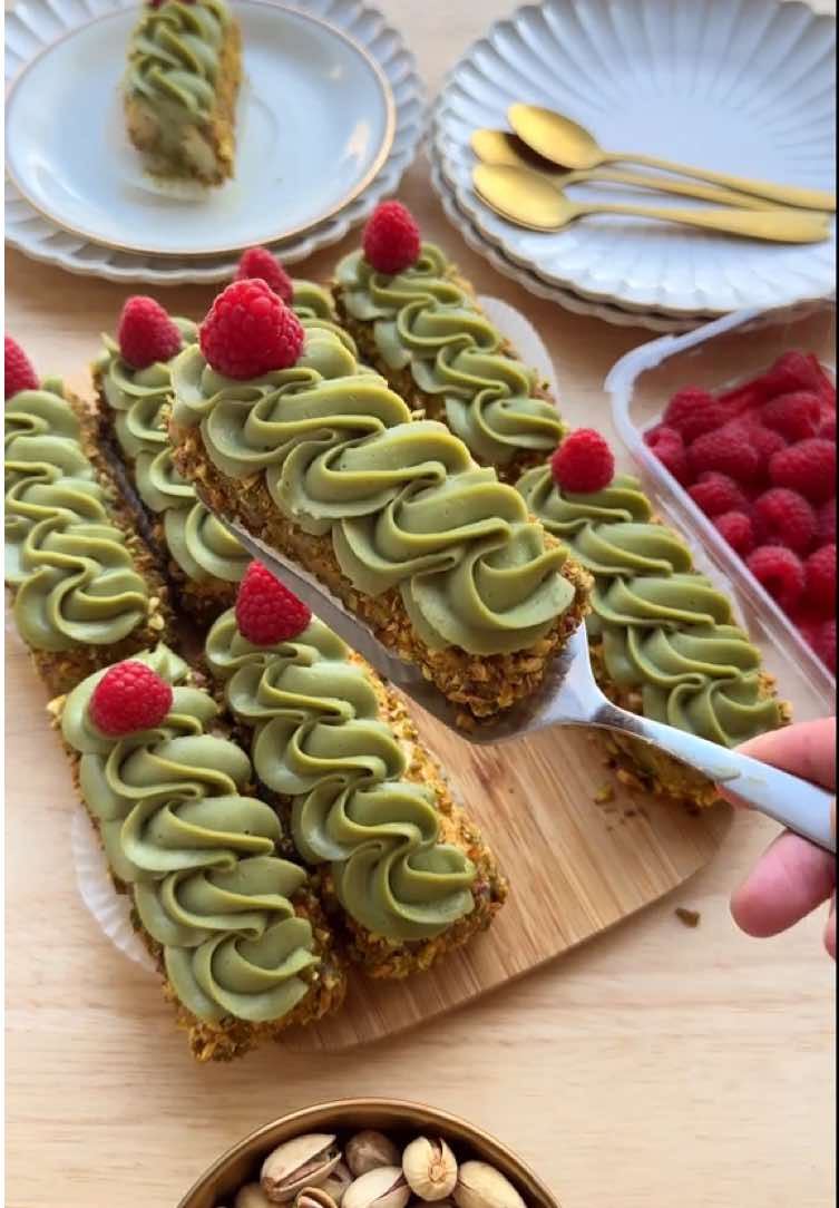 EASY PISTACHIO DESSERTS (NO BAKE) #Recipe #food #pistachio #dessert #nobake #tasty #Ramadan #ramadan2025 #iftar PISTACHIO CREAM   250 g mascarpone   25 g powdered sugar   200 g pistachio paste   COOKIES   ladyfingers   GARNISH milk   chopped pistachios   Mix the mascarpone, powdered sugar, and pistachio paste until smooth. Transfer the pistachio cream into a piping bag.   Take one ladyfinger and pipe a dollop of pistachio cream on top. Place another ladyfinger on top and press gently.   Pour the milk into a bowl. Spread pistachio cream along the sides of each pastry. Briefly dip the pastry in the milk, then roll the sides in the chopped pistachios.   Place the pastry on a piece of parchment paper and pipe a long strip of pistachio cream on top. Let it firm up for the perfect texture.   Tips:   Use pistachio paste with a high percentage of pistachios for an intense pistachio flavor.   Dip the pastries quickly in the milk to soften them, but avoid making them too soggy. A short dip is enough.   After assembling, refrigerate the desserts for 4-5 hours, preferably overnight. This allows the flavors to meld and makes them even more delicious!
