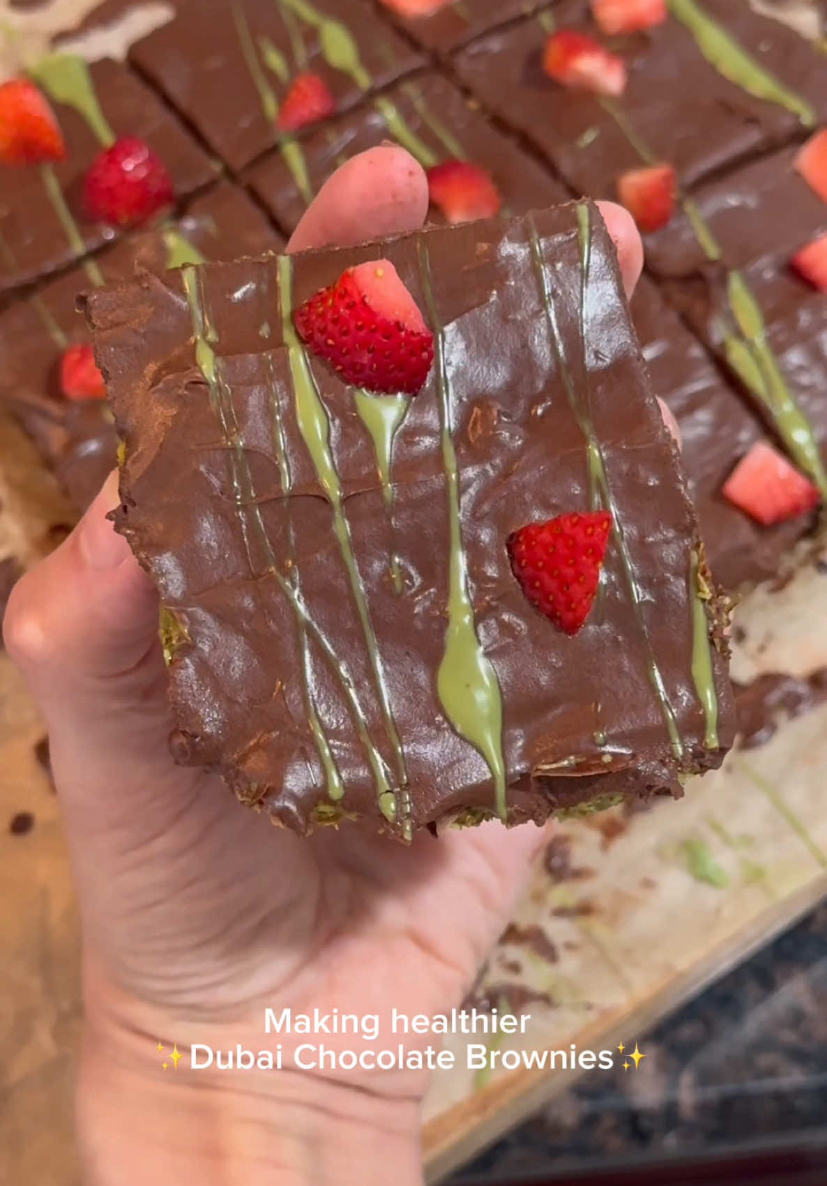 Healthier Dubai Chocolate Brownies ✨🍫 Rich, fudgy brownies with a Middle Eastern twist! A guilt-free indulgence with layers of crispy kadayif, creamy pistachio, and fresh strawberries for the perfect balance of flavor and texture. Ingredients: 📦 1 zero sugar brownie package 🥄 1/2 cup non-fat Greek yogurt (replaces oil) 💧 1/4 cup water 🥚 2 eggs 🍜 3 oz kadayif (ordered off Amazon) 🌿 4 tbsp pistachio cream (ordered off Amazon) 🍫 Zero sugar chocolate frosting 🍓 Strawberries How to make them: 1️⃣ Replace oil with Greek yogurt & bake brownies as directed. 2️⃣ Brown kadayif in butter until golden, then mix with pistachio cream. 3️⃣ Spread the kadayif-pistachio mixture over brownies. 4️⃣ Top with a thin layer of chocolate frosting, a drizzle of pistachio cream & diced strawberries. 5️⃣ Cut into squares & enjoy! #HealthyBrownies #DubaiFlavors #GuiltFreeDessert #ChocolateLover