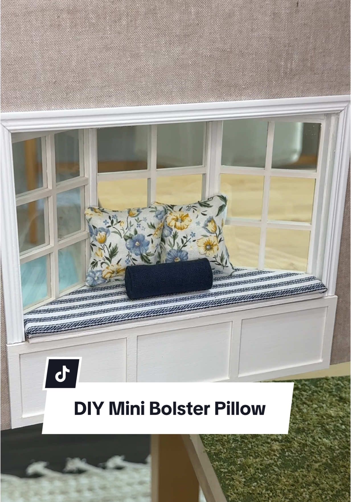 You guys were right, the big navy pillows were too overwhelming for this bench seat and a bolster pillow was the perfect addition to the two smaller floral pillows. I think this bench looks so cozy now and I wish I had a bay window in my kitchen in real life so I could remake this for my own home 😍 #dollhouse #DIY #hobby #miniatures #dollhouseremodel #dollhousemakeover #craft #diycraft #beforeandafter #homeremodel #tranformation #kitchenremodel #throwpillows 