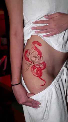 Graceful yet bold—this fine line and illustrative tattoo of a red snake 🐍 and delicate flower symbolizes both power and elegance. #FineLineTattoo #IllustrativeTattoo #SnakeTattoo #FloralInk #RedInkTattoo #TattooInspiration #InkAddict #BodyArtistry #TattooLovers #ElegantInk #snake #tattoo #bali #balitattoo #tattoobali #balitrip #fineline