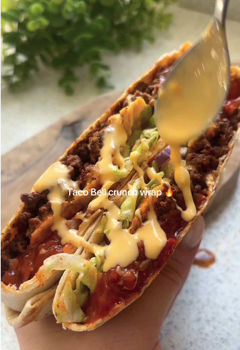 Taco Bell crunch wrap 😮‍💨  Ready in less than 10 mins and 45g protein in! 💪 ‼️ AND if you’re stuck for meal ideas I’ve got 200+ easy recipes, meal plans & shopping lists on my NEW APP!! 🔥  Access all my recipes using the link in my bio 💕  Macros 574 calories 45gP / 18gF / 57gC Serves: 2    Shopping list ✍️  - 250g lean beef mince - 20g taco seasoning  - 70g salsa  - 1 beef stock cube - 40g iceberg lettuce, shredded  - 5 cherry tomatoes, finely diced  - 20g red onion, finely diced  - 40g light cheddar, grated  - 2 tbsp sour cream  - 2 tortilla wraps  - 6g tortilla chips  - 2 mini tortilla wraps  Optional: a tbsp nacho cheese sauce to drizzle over each wrap! 🥵 Method Fry the beef mince for a few mins to brown  then add the taco seasoning, 3 tbsp salsa and crumble over the beef stock cube mixing well. Add a dash of boiling water if needed to loosen.  Place the beef mixture in the middle of the large tortilla, then the rest of the ingredients shown in the video. Place the mini tortilla on top, fold then place in a pan sprayed with oil for a few mins either side to brown and enjoy!  #healthyrecipes #EasyRecipes #healthymeal #lowcalorie #fakeaway #highprotein #mealprep #weightloss #healthyeating #caloriedeficit #tacobell #wrap #fyp 