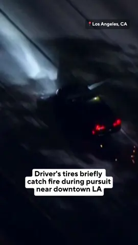 A traffic violation suspect led the Seal Beach Police Department on a pursuit through Los Angeles on Monday night. SkyCal was overhead as the tires blew out, causing sparks and flames to shoot from underneath the car as it sped along the I-5 Freeway near downtown. The suspect jumped out of the car along the Echo Park exit and started running around the lanes as cars passed before, eventually, surrendering to police as they pulled up him.