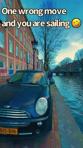 Amsterdam parking be like: One wrong move, and you’re setting sail! ⛵😂 Who needs a garage when you have a canal? Would you dare park here? 🚗💦 #AmsterdamLife #ExtremeParking #OneStepFromSwimming #realtor #realtorlife #realtorwhotravels #traveltime #travel 