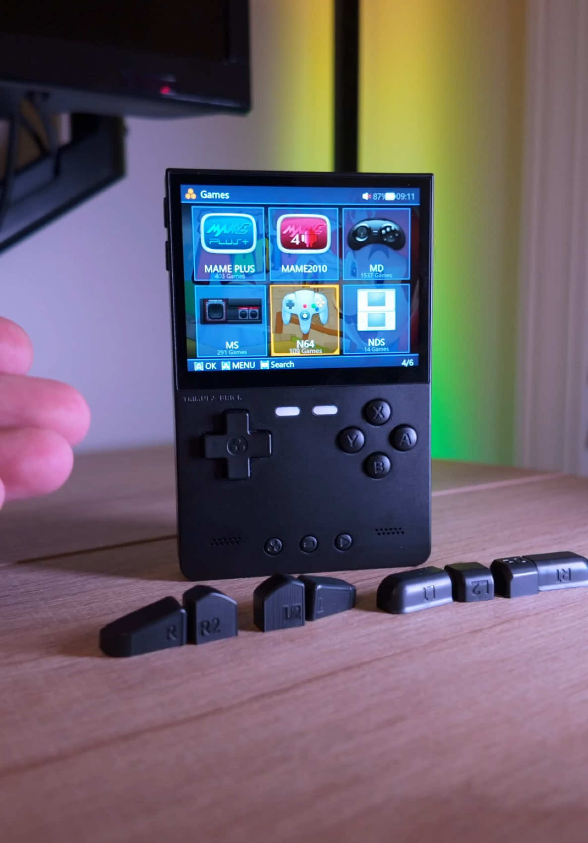Trimui Brick Handheld Game Console. This handheld game console is packed full of unique features! #handheldgaming #retrogaming #retrogames #retrogamer #GamingSetup #trimuibrick 