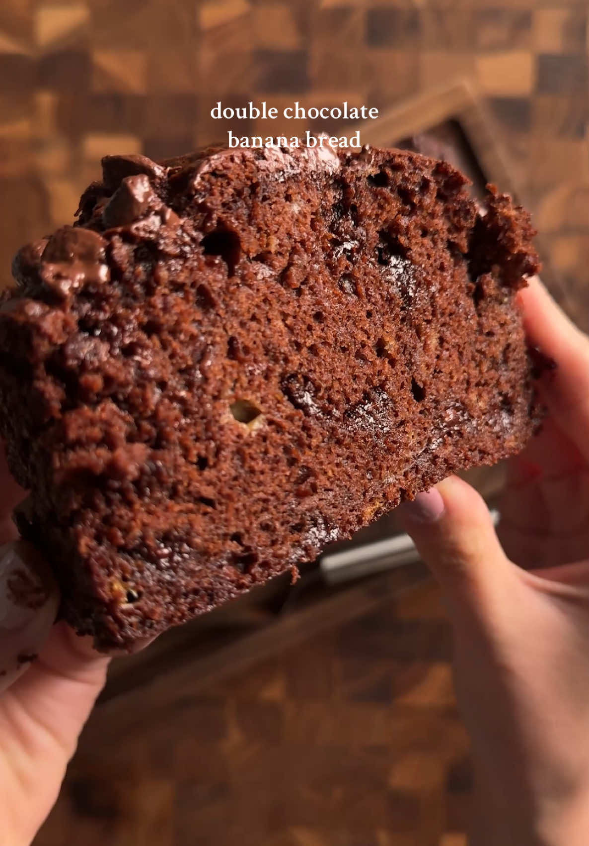 double chocolate banana bread 1 1/4 cup (155g) flour 1/2 cup (50g) cocoa powder (not Dutch-processed) 1 tsp (5g) baking soda 1/2 tsp (3g) salt 1/2 cup (113g) unsalted butter, softened 3/4 cup (150g) sugar 2 eggs 1/4 cup (60g) Greek yogurt 3 large bananas (or 4 small ones) (~340g mashed) 1 tsp (4g) vanilla 2 tbsp (30g) hot water 3/4 cup (130g) semi-sweet chocolate chips whisk together flour, cocoa powder, baking soda, salt. in a large bowl, mash bananas then add in butter, sugar, eggs, greek yogurt, and vanilla. mix well. then add the dry to the wet and fold in gently. also at this point, add in the 2 tbsp of hot water and chocolate chips. be careful to not overmix.  pour into your baking pan and sprinkle on additional chocolate chips (optional). bake at 350f for 60-65 min or until a toothpick comes out clean. #bananabread #chocolatebananabread #baking #baketok #Recipe 