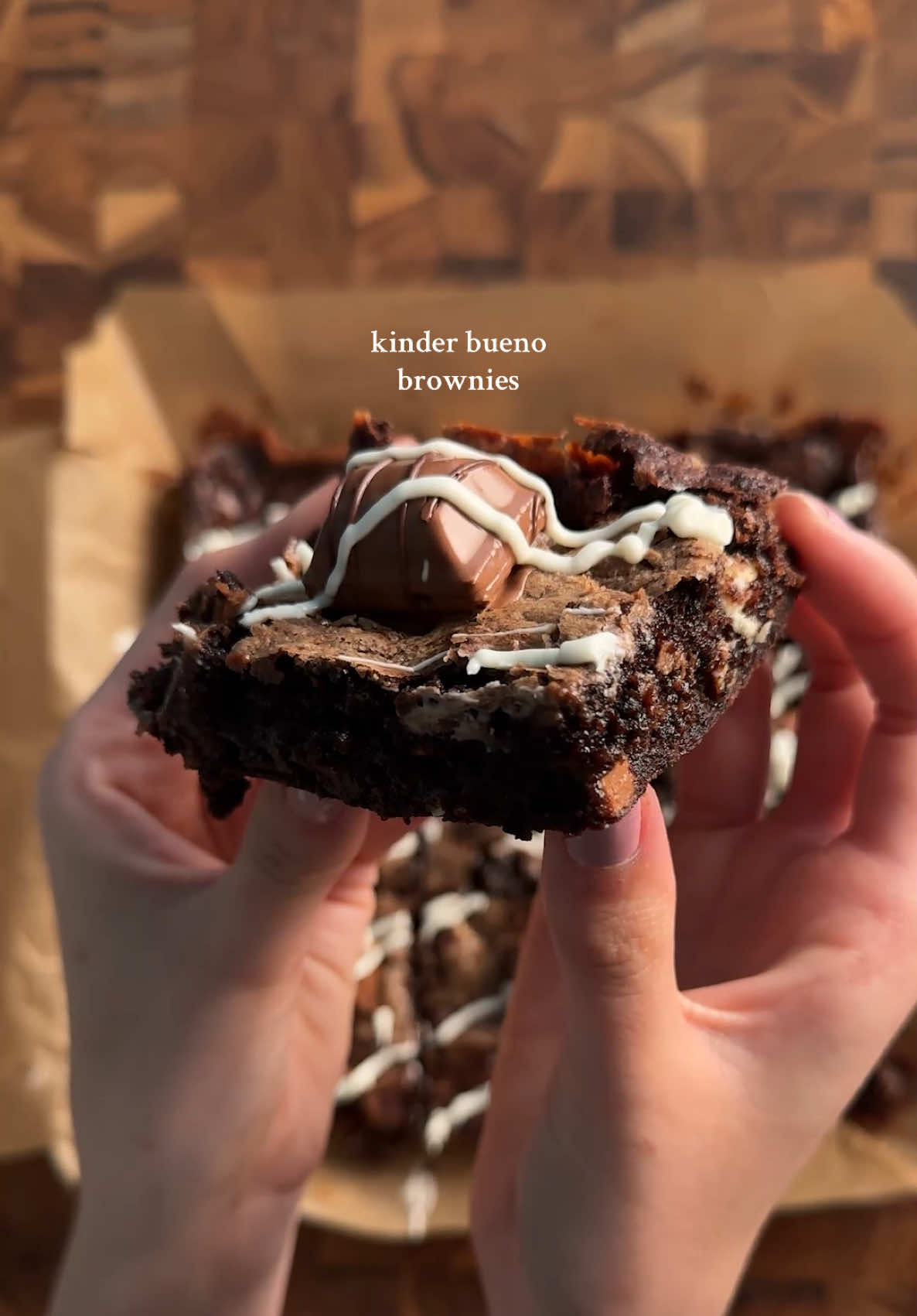 kinder bueno brownies 2 eggs 1/2 cup (42g) cocoa powder 1/2 tsp (3g) each salt, baking powder, espresso powder 1 1/2 tsp (6g) vanilla 1/2 cup (113g) unsalted butter (melted) 1 cup (200g) sugar 3/4 cup (90g) flour 3/4 cup (120g) chocolate chips mix together eggs, cocoa powder, salt, baking powder, instant espresso, and vanilla. in a separate bowl cream butter and sugar, then microwave gradually until sugar dissolves and is shiny. Combine the egg and butter mixtures well, then add flour and mix gently, do not overmix. pour half the mixture into a 9x9 pan, and then layer on the hazelnut cream mixture. then cover with the rest of the brownie batter. bake at 350 for 28-32 min. optional: after baking, top with kinder bueno pieces and melted white chocolate! hazelnut cream (middle) 1/4 cup heavy cream 1/8 cup cream cheese 3 tbsp nutella 1/2 cup powdered sugar 1/4 tsp vanilla mix together cream cheese and heavy cream until smooth. then add in the nutella and vanilla and mix well. add in powdered sugar a little at a time until its at your desired texture #kinder #kinderbueno #brownies #baketok #Recipe 