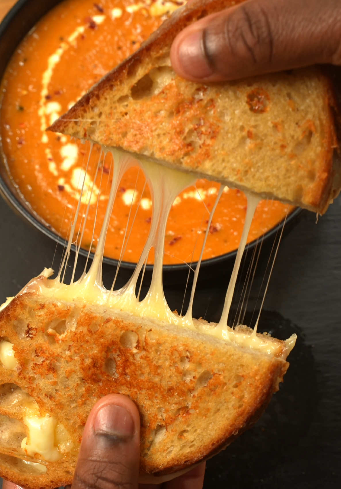 OVEN ROASTED TOMATO SOUP Yield - 4 Servings  Roast at 400F (200C) for 40-50 mins Roast -  2 Whole Heads Garlic  2 Lbs Roma tomatoes  4 Whole Shallots (2 Small Yellow Onions) 1 Tbsp Coarse Salt 2 Tsp Ground Black Pepper 1 tsp Oregano  1/3 Cup Olive oil  1 1/2 Tsp Red Chili Flakes  Soup base -  1/3 cup Sherry cooking wine  2 Cups Chicken Broth  1 Tbsp Tomato Paste 2 Tbsp Chopped Basil  1 Tsp Onion Powder 1 Tsp Garlic Powder 1/2 Tsp Italian Seasoning  3 Tbsp Salted Butter  1/2 Cup Fresh Parmesan  ———— Garnish -  Fresh Basil  Parmesan Freshly Cracked Black Pepper ————- Grilled Cheese  Sour dough  White Cheddar cheese  ——————————— #thatsavagekitchen #tomatosoup #Foodie #foodporn #tomato #vegetarian #EasyRecipes #fyp #cooking #soup #soupseason  https://www.thatsavagekitchen.recipes/recipes/oven-roasted-tomato-soup