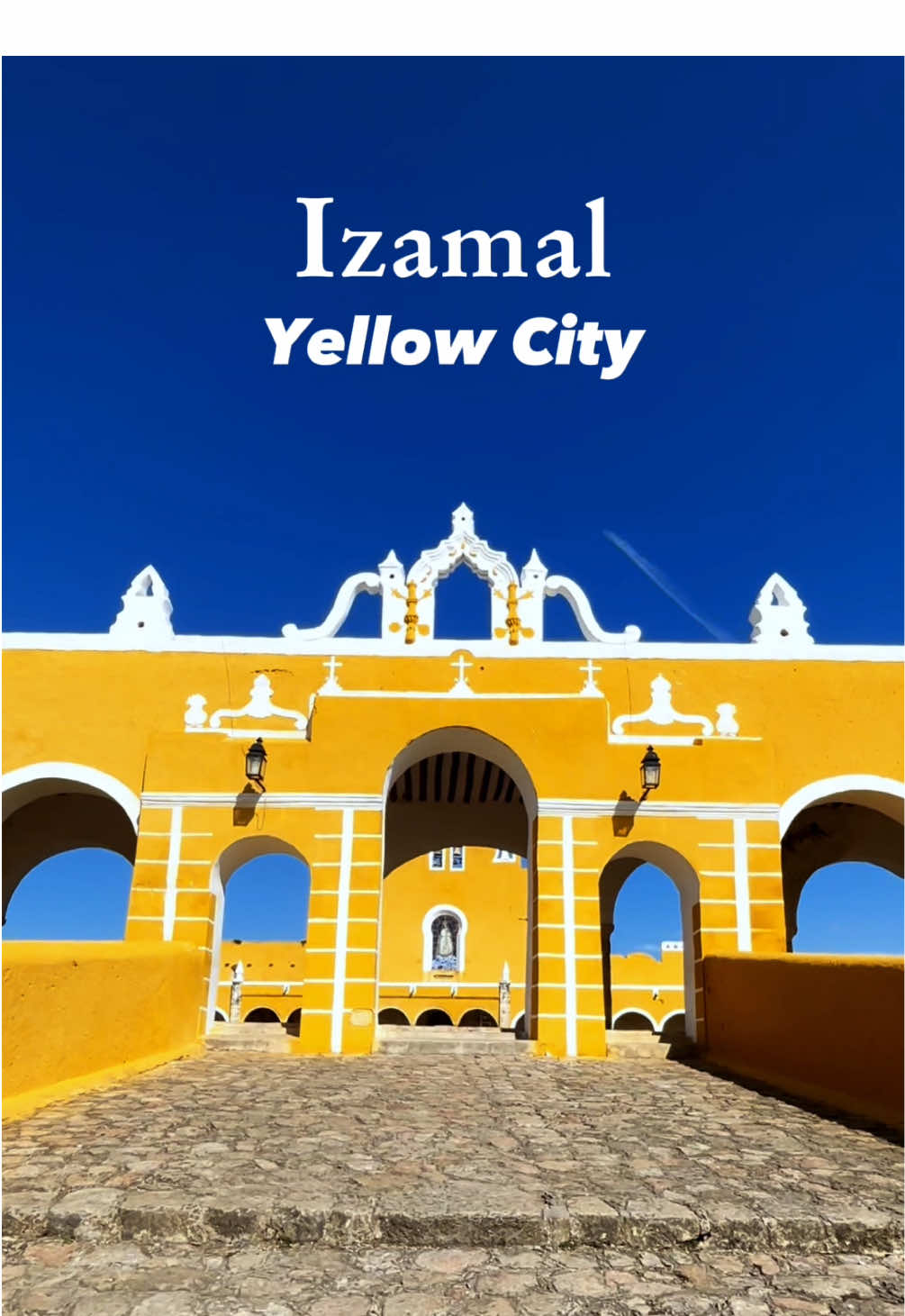 Izamal, known as *La Ciudad Amarilla* (The Yellow City), is about an hour from Mérida by bus, with tickets costing around $5 CAD or less. This historic town is famous for its colonial architecture, Mayan ruins, and its striking yellow buildings. One of its highlights is *Kinich Kakmó*, a pre-Hispanic pyramid that visitors can still climb for panoramic views of the town.   I thought climbing up would be the challenge, but I got myself into a bit of a pickle—turns out, my fear of heights kicked in *hard* on the way down. I was almost frozen in place until, believe it or not, someone actually had to offer to come and help me get down! Lesson learned: easier up than down.   Music: *Flauta de pan* - Mario González Guerra