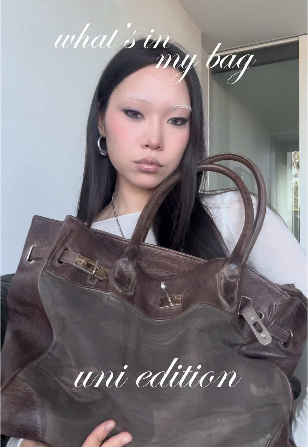 what’s in my bag uni edition #fyp #foryou #whatsinmybag #bagtour #journaling #journaltok #citybag #firkin #birkin #vintage #celine #perfume #saintlaurent #hourglass #mac #fashioninspo #pinterest #bleachedbrows #smokeyeye 