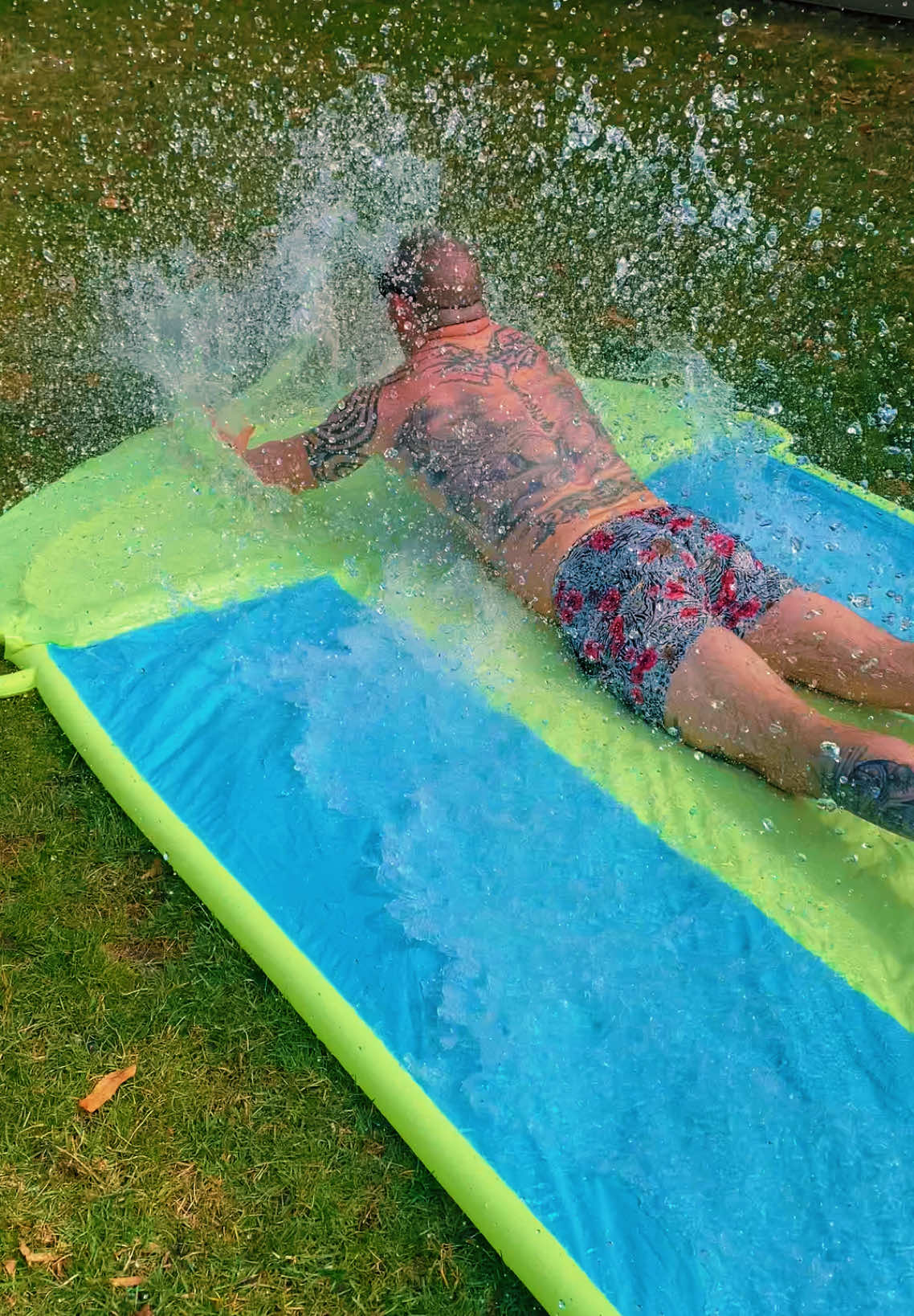 First warm day means water toys #swim #swimtrunks #tiktokshop #dadsoftiktok #daddy #slipandslide #water #springday #wet #wifehumor 