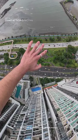🪂 When your friend says they're downstairs! Capture the thrill of the leap with Osmo Action 5 Pro! 🚀  🪂 : @mateomassoni #BaseJumping #OsmoAction5Pro #djiosmo🏙️✨