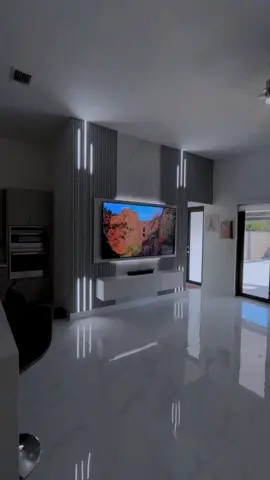 This is a profile lighting effect on a TV console design giving the living room an ambient feeling and an amazing view. what do you like about this profile lighting system delaying like a running light? be inspired ✨♥️ #livingroomdecor #tvconsole #tvshow #luxurydesign #profilelight #livingroominspo #livingroomideas #livingroominspiration 