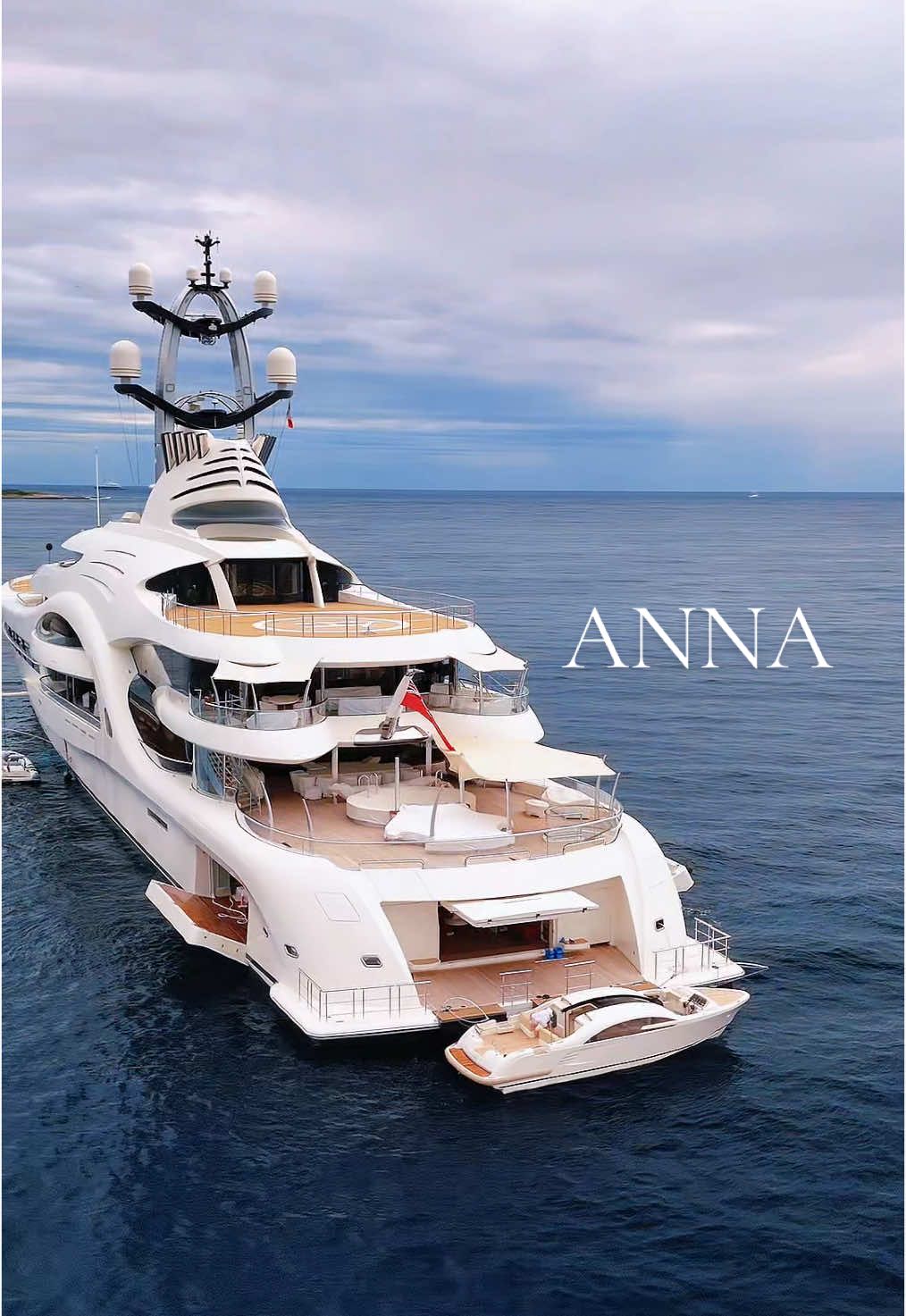 Anna isn’t just a superyacht—she’s a floating masterpiece. Oyster-white hull, sculpted curves, and massive glass panels give her a futuristic edge. The mast? Engineered for top-tier internet and seamless connection. The foredeck? A helipad that transforms into a football pitch in minutes. And the aft deck? The FIRST on a yacht to land a tilt-rotor aircraft. Innovation at sea just hit another level.  • #visitmonaco #monaco #frenchriviera #luxuryyachts #yachtcharter #yachtchartermonaco #yachtcommunity #yachtsworldwide #yachtstemple #yachtliving #yachtworld #luxuryyachtcharters #boatlife #yachting #yachtcrew #SuperyachtLuxury #yachtlife #Anna #annayacht