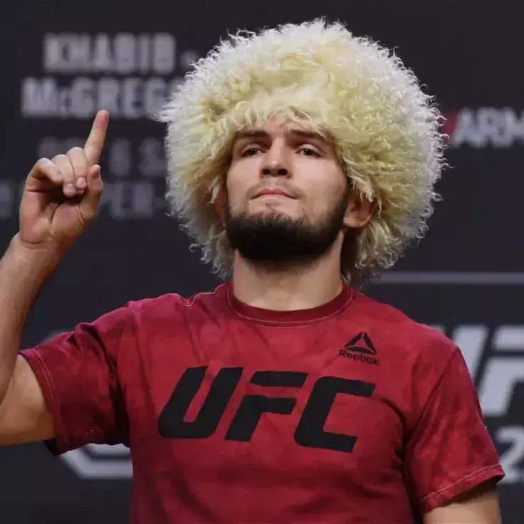 Khabib Nurmagomedov, born September 20, 1988, is a veteran undefeated UFC lightweight champion (29-0). Hailing from Dagestan, Russia, he dominated with his elite grappling and relentless pressure. Trained by his father, Abdulmanap, Khabib defended his title three times before retiring in 2020 . A MMA legend.