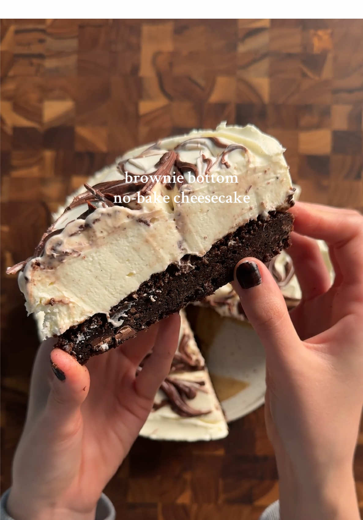 brownie bottom no-bake cheesecake *you can use whatever brownie recipe or box mix but this is the one i used: 2 eggs 1/2 cup (42g) cocoa powder 1/2 tsp (3g) each salt, baking powder, espresso powder 1 1/2 tsp (6g) vanilla 1/2 cup (113g) unsalted butter (melted) 1 cup (200g) sugar 3/4 cup (90g) flour 1/4 cup (43g) chocolate chips mix together eggs, cocoa powder, salt, baking powder, instant espresso, and vanilla. in a separate bowl cream butter and sugar, then microwave gradually until sugar dissolves and is shiny. Combine the egg and butter mixtures well, then add flour and mix gently, do not overmix. pour this into a spring form pan (9inch) and bake at 350 for 30 minutes, let cool completely cheesecake filling: 1 1/4 cup (300g) heavy cream 24 oz (680g) softened cream cheese 1/2 cup (100g) sugar 2 tbsp (15g) powdered sugar 1/4 cup (60g) sour cream 2 tsp (10g) lemon juice 1 1/2 tsp (6g) vanilla 1/2 cup (85g) chocolate (chopped small) extra 1/3 cup (85g) biscoff spread for the middle layer *whip the heavy cream into stiff peaks. if its not thickening after about 4 minutes, add 1-2 tbsp of sugar to help it stiffen. set this aside. in a large bowl, beat (mixer is best) the cream cheese with sugar until well incorporated. then add in powdered sugar, sour cream, lemon juice, and vanilla until all smooth. then add in 1/2 cup of biscoff spread until combined. into the mixture, fold in half of the whipped cream with a spatula. careful not to overmix, be gentle because you want to keep the fluffiness. once this is almost fully combined, add in the other half of whipped cream folding it gently. #brownie #cheesecake #browniecheesecake #baketok #Recipe 