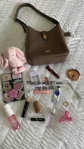 Girly essentials only 💋 • • • • @Summer Fridays @Jellycat @Coach @rhode skin @MERIT Beauty @Charlotte Tilbury @LOCCITANE @Sol de Janeiro @Kayali  @Diorbeauty @touchland @YSL Beauty  #whatsinmybag #whatsinmypurse #coach #bagessentials #imjustagirl #summerfridays #bagtok #rhodeblush #jellycat #lipbalm 