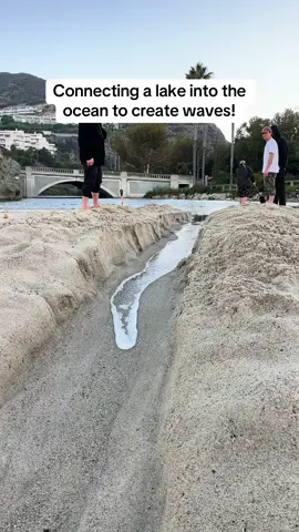 We dug this sand dam with a shovel and opened it up into the ocean to create surfable waves in CA #surf #surfing #riverwave #riversurfing #bigwaves #surftok #ocean 