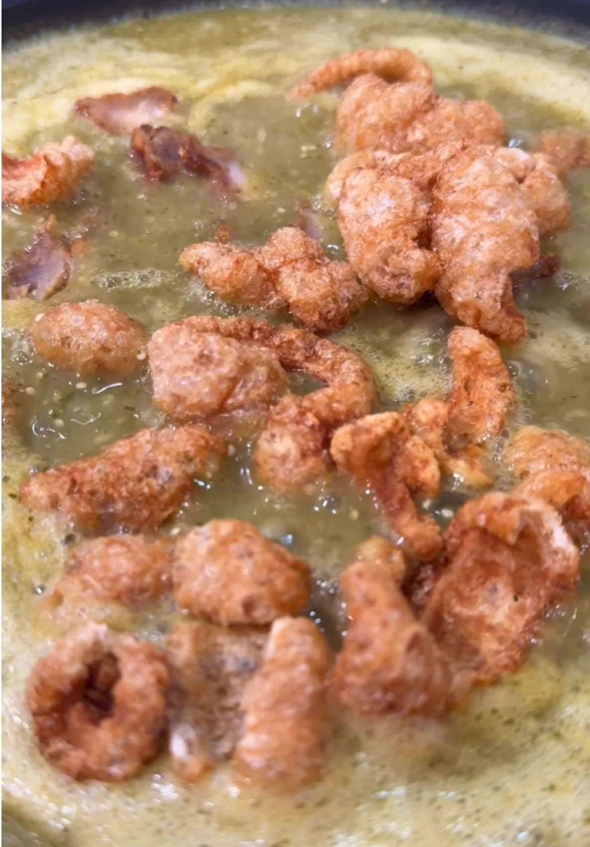 Easy, quick and delicious Chicharron en salsa verde! Y por qué no?  Pork Rinds in green sauce 🐷  Ingredients purchased at Northgate Market ❤️ •1/2Ib chicharron con carne/with pork meat  •1/2Ib chicharron/pork rind’s •1/2Ib chicharron pork rinds with a harder texture  •20 tomatillos  •1 Roma tomato •3-4 Serrano’s (depends how spicy you’d like it. I ended up using 3) •1/2 cilantro bunch  •1/2 cilantro diced to add into chicharron while it cooks •1/2 white onion  •4 garlic cloves  •10-15 black pepper corns (depending on the size) •2 tablespoons chicken bouillon  1. Boil 20 tomatillos, 3-4 serranos and 1 Roma tomato till your tomatillos start changing color. Remove and add in blender with, 1/2 onion, 1/2 cilantro bunch, 4 garlic cloves, 10-15 pepper corns and 2 tablespoons of chicken bouillon. Blend well  2. In a pan add several tablespoons of oil and once your oil is hot, pour in your salsa. Add more chicken bouillon or salt if needed. Be careful on the salt since the chicharron could sometimes be salty.  3. Once your sauce starts to simmer, add in your crushed chicharron and allow it to cook for about 10 minutes or until your chicharron gets tender. Your chicharron needs to soften up. Once done add diced cilantro (this is optional)  4. Serve with a Mexican rice, refried pinto beans or simply in a taco with queso fresco  #chicharron #pork #porkrecipe #homechef #cookingtiktok #letscook #mexicanfoodrecipes #comidamexicana #puerco #EasyRecipes #recetasfaciles #homecook 