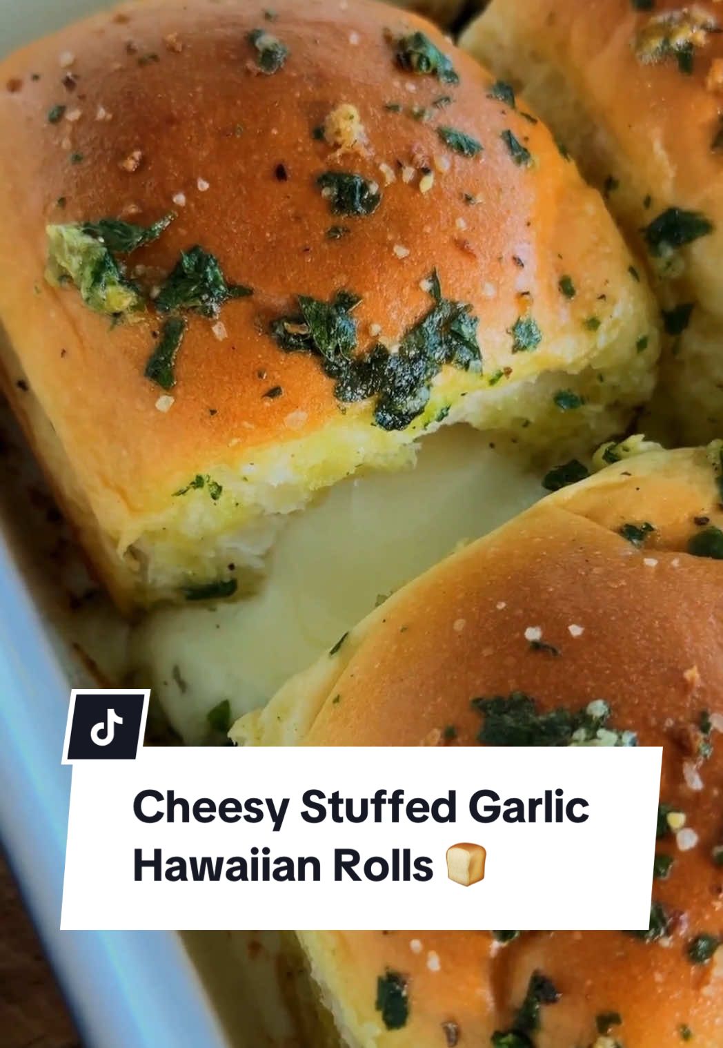 You made the right rolls famous! 🍞 That's right, Hawaiian Rolls are back and more garlicky than ever! These Cheesy Stuffed Garlic Hawaiian Rolls are the perfect addition to any party or weeknight meal. For the full recipe, continue reading or click the link in the @allrecipes bio! 🔗 Ingredients: 1 (12-count) package Hawaiian rolls 6 mozzarella string cheese sticks 5 tablespoons butter 2 cloves garlic, finely minced 2 teaspoons dried parsley 1/2 teaspoon salt 1/4 teaspoon freshly ground black pepper 1 tablespoon grated Parmesan cheese (optional) Directions: Preheat the oven to 350 degrees F (175 degrees C). Separate each roll and, using a paring knife, cut a 1/2-inch slit in the side and hollow out a small hole, taking care not to cut all the way through.  Cut each string cheese in half and stick 1 piece into each prepared roll.  Place rolls in a baking dish nestled close to each other. Place butter, garlic, parsley, salt, and pepper in a small microwave-safe bowl or measuring cup and cover loosely with a paper towel. Microwave until melted, stirring halfway through, until melted, 30 seconds to 1 minute. Brush butter mixture generously over each roll and sprinkle with grated Parmesan. Bake in the preheated oven until rolls are golden brown and lightly toasted, 15 to 18 minutes. 🧑‍🍳: @NicoleMcLaughlin  #garlicbread #hawaiianrolls #garlic #bread #easyappetizers #appetizers #dinnerrolls #partyfood #cheese #cheesybread