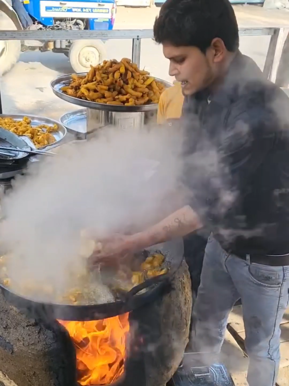 A street vendor who takes fried potatoes out of boiling oil with his hands. I wonder how this is scientifically possible. A young street food vendor dips his bare hands into the oil bubbling over the fire and slowly takes the fries. This is not a trick, the young man's hands are not burned, as if by a miracle. #nature #people #amazing #fypp #StreetStyle #street #streetfood #fired #potatoes #boiling #hotoil #interesting #hands #fyp #human 