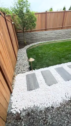 Trust Nature Landscaping #outdoorliving #design #landscape  #hardscape #wedoitall #paverinstallation #retainingwall #grass #fence #whitepebbles #nature #construction #share #reels #TikTokShop #fyp #viraltiktok 