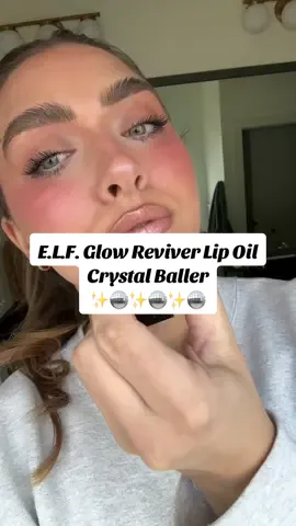 This is so niche but this @e.l.f. Cosmetics glow reviver lip oil is giving Patrick Ta lip shine in shade She’s Expensive 👀