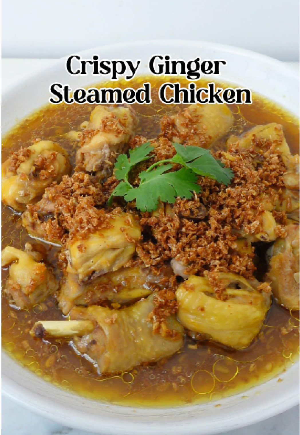 Easy Crispy Ginger Steamed Chicken Ingredients: 90g ginger 1/2 tsp salt 1/2 tsp chicken powder some white pepper 1 tbsp light soy sauce 700g chicken, bone in Instructions: 1. Blitz fresh ginger and squeeze out the juice. 2. mix in salt, chicken powder, white pepper, and soy sauce—then pour this marinade over the chicken and let it sit for 30 minutes. 3. While it marinates, fry the ginger until golden and crispy—set that aside. 4. Place the chicken on a steaming plate, pour the marinade over, and steam for 30 minutes. 5. Once it’s done, move the sauce to a pan and simmer with some of that fried ginger. Thicken it with cornstarch slurry. 6. Pour the sauce back over the chicken, sprinkle with crispy ginger, and serve! #chicken #steamedchicken #gingerchicken #EasyRecipe 