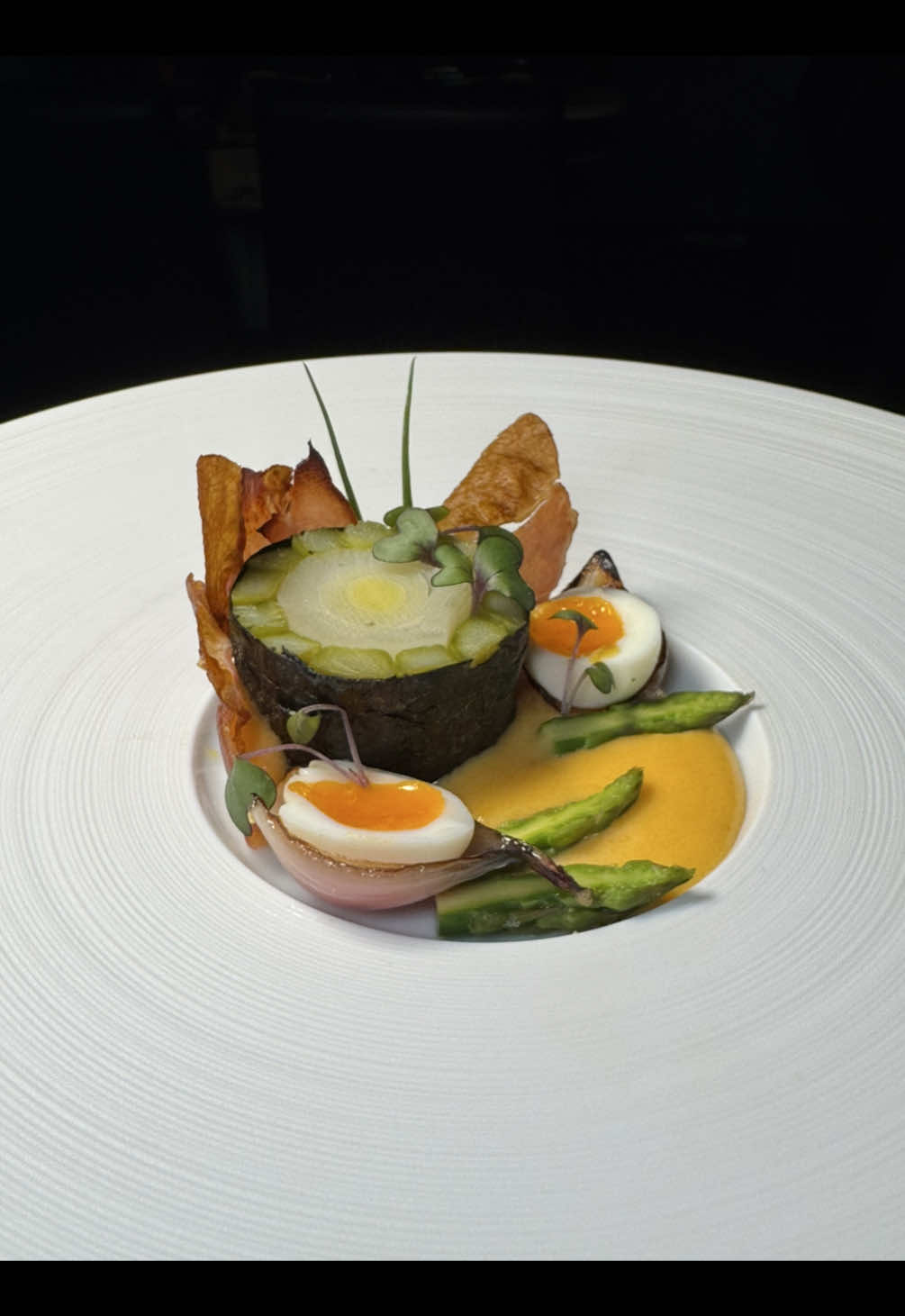 Asparagus and Leek Mosaic with yuzu hollandaise, crispy prosciutto, quail egg and caramelized shallot.  Full recipe coming soon 😁 The perfect brunch dish taking classic flavor combinations, adding yuzu to liven up the traditional hollandaise, quail egg instead of poached egg, crispy prosciutto for a hit of salt.  #asparagus #hollandaise #yuzu #prosciutto #brunch #eggs #eggsbenedict #breakfast #plating #theartofplating 