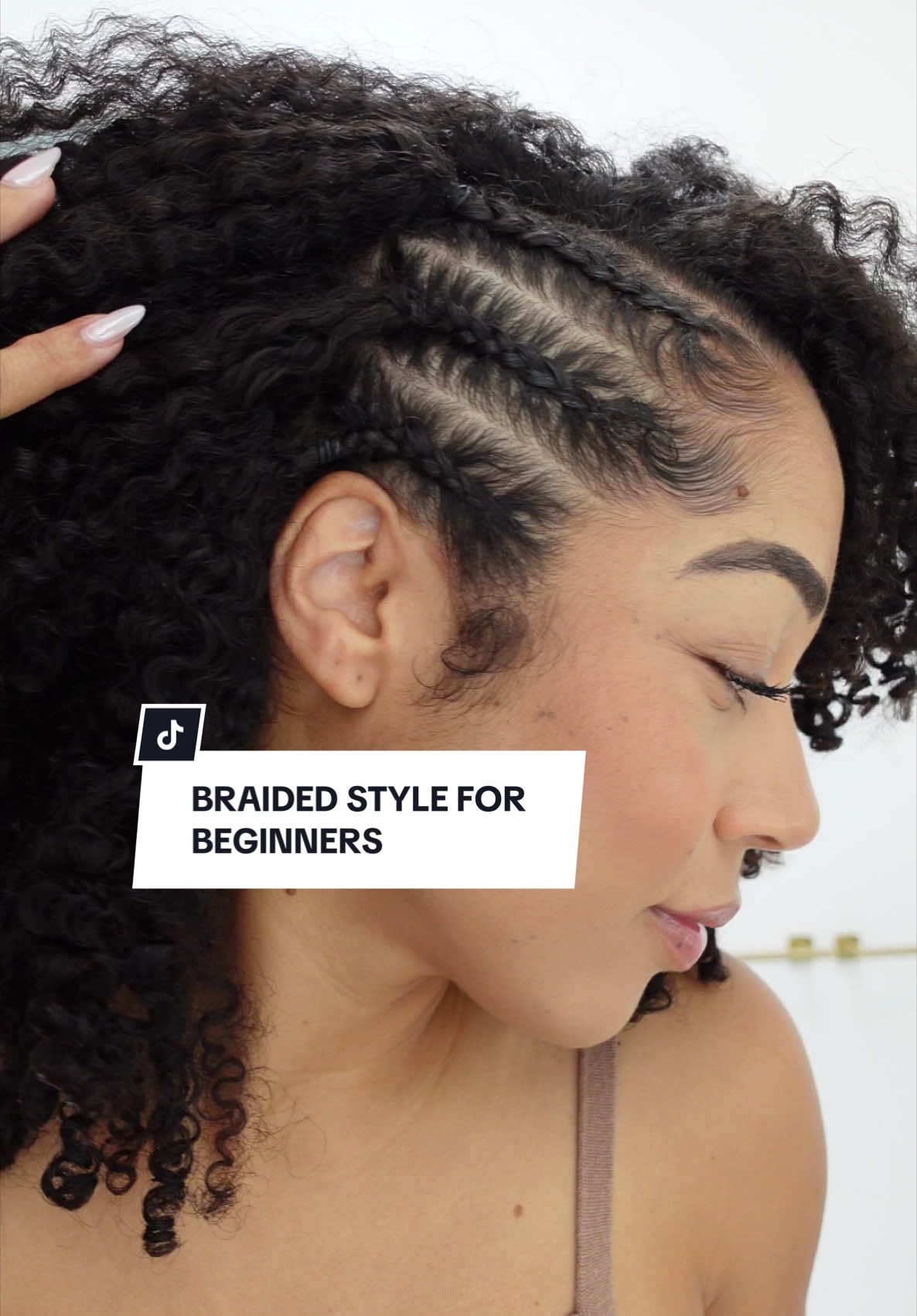 A braided hairstyle for beginners 🫶🏽 (Save for later!) Surprisingly smaller braids are much easier to practice with, and with a little water or product, your fingers can glide thru & practice the motion over & over.  I love doing this little braided side when I want to mix up my usual wash & go, so save this hairstyle for the next time you have a little time! 💌 Styled with @SheaMoisture Curl Enhancing Smoothie, Edge Gel & Styling Gel  #howtobraid #braidedhairstyle #naturalhairstyles #curlyhairstyles #naturalhairstyle