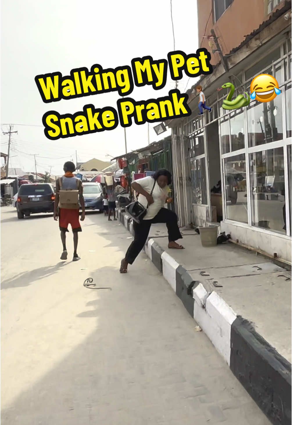 Walking a Fake Snake In Public🚶🏽🐍 funny reactions😂 #mrolawits #snake #reactions #publicreaction 