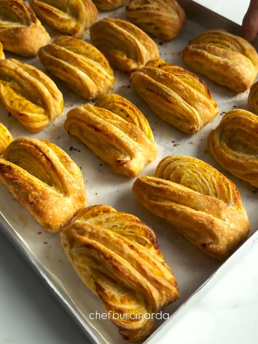 🌺PATATESLİ BÖREK🌺 🌺🌺🌺🌺🌺🌺🌺🌺🌺🌺🌺 chefburcinarda:🎥 Malzemeler; 🌺500 g un(4 su bardağı) 🌺350 ml su(1 su bardağı+3/4su bardağı) 🌺10 g tuz(1 tatlı kaşığı) 🌺2 g toz maya(1 çay kaşığı) 🌺10 gram kadar toz şeker(1 tatlı kaşığı) Yufkalara sürmek için; 🌺200 g tereyağını eritip soğutun İç harcı için; 🌺5 orta boy patates(Haşla ez) 🌺Karabiber,pul biber,toz biber kullandım  🌺Yarım çay bardağı sıvıyağ ekleyip hepsini karıştırdım Hazırlanışı; Hamuru yapalım hadi,unu karıştırma kabına al ortasını havuz şeklinde aç mayanı ve şekerini ekleyip üzerine ılık suyunu ekle maya 5 dk aktifleşsin arından tuzunu ekle ve hamurunu yoğur(Her unun huyu farklıdır çok sert olursa 2 yemek kaşığı kadar daha su ekleyebilirsin,suyun sıcaklığı çok önemli ne sıcak ne soğuk olacak,cıvık olursada az un ekleyebilirsin)hamuru 20 eşit parçaya ayır bezele,bezelerin üzerini hava almayacak şekilde kapatıp 30 dk dinlendir süre sonunda her bezeyi servis tabağı büyüklüğünde açıp her katına yağ sürerek üst üste buz dolabına yolla ortalama 15-20 dk beklet(İçindeki yağ donana kadar)buz dolabından çıkardıktan sonra kare formda aç hamurunu(İnce olsun merdaneyle aç oklavaya gerek yok)patatesini yay rulo şeklinde sar dev bi rulon olacak onuda çekiştir elinle uzat iyice ardından videodaki gibi şekil verip üzerine yağ sür 180 derece önceden tamamen ısınmış fırında üzeri kızarana kadar pişir,dilersen hamuru 2’ye bölüp her yerini yağlayıp zarf şeklinde kapatıp tekrardan açarakta yapabilirsiniz. Afiyet olsun.🌺 İNGİLİZCE: 🌺POTATO PASTRY🌺 🌺🌺🌺🌺🌺🌺🌺🌺🌺🌺 Ingredients; 🌺500 g flour (4 cups) 🌺350 ml water (1 cup + 3/4 cup) 🌺10 g salt (1 teaspoon) 🌺2 g powdered yeast (1 teaspoon) 🌺10 grams of granulated sugar (1 teaspoon) To spread on the pastry; 🌺Melt and cool 200 g butter For the filling;  🌺5 medium potatoes (Boil and mash) 🌺I used black pepper, red pepper flakes, red pepper powder 🌺I added half a tea glass of oil and mixed everything Preparation;  Let's make the dough, put the flour in a mixing bowl, open the middle in the shape of a pool, add the yeast and sugar, add the warm water, let the yeast activate for 5 minutes, then add the salt and knead the dough (Each flour has a different characteristic, if it is too hard, you can add 2 more tablespoons of water, the temperature of the water is very important, it should be neither hot nor cold, if it is runny, you can add a little flour) divide the dough into 20 equal parts, cover the balls so that they do not get air and let them rest for 30 minutes. At the end of the time, open each ball to the size of a serving plate, apply oil to each layer and send them to the refrigerator on top of each other, wait for about 15-20 minutes (Until the oil inside freezes) After taking it out of the refrigerator, open your dough in a square shape (Make it thin, open it with a rolling pin, no need for a rolling pin) roll the potato in the shape of a spring roll, you will have a giant roll, pull it and stretch it with your hand well, then shape it as in the video and apply oil on it, bake in a preheated oven at 180 degrees until it turns golden brown, if you wish, bake the dough  You can also divide it into 2, grease each part, close it like an envelope and open it again. Enjoy.🌺 🌺🌺🌺🌺🌺🌺🌺🌺🌺🌺🌺🌺 🌺#reklamdeğil 🌺#instagram 🌺#keşfet 🌺#nefisyemektarifleri 🌺#mutfak 🌺#foodlovers 🌺#tarifsunum 🌺#hamurişi 🌺#yemektarifleri 🌺#kuchen 🌺#sunumönemlidir 🌺#tatlitarifleri 🌺#poğaçatarifleri 🌺#instafood 🌺#pastatarifleri 🌺#kahvesunumu 🌺#kektarifleri 🌺#rezepti 🌺#börektarifleri 🌺#sunum 🌺#kurabiyetarifleri 🌺#coffee 🌺#akşamyemeği 🌺#yummy 🌺#mutfakgram 🌺#sunum 🌺#kolaytarifler 🌺#sütlütatlilar 🌺#yemek 🌺#sahanelezzetler 🌺#keşfetteyiz