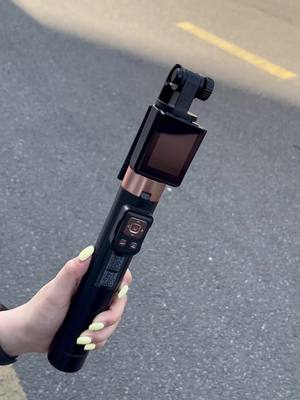 Cell phone with monitor screen rear shooting tripod selfie stick.